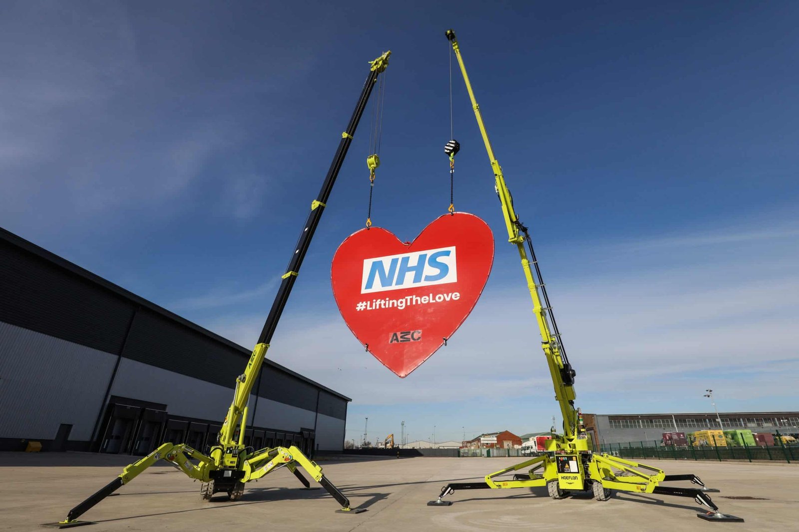 Liverpool crane hire firm AMC launches fundraiser by lifting a giant heart into the sky in honour of NHS heroes