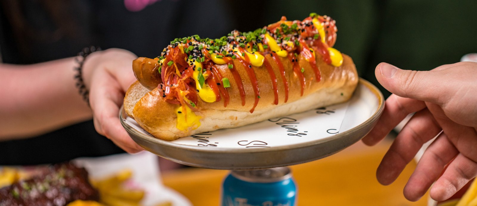 Celebrate National Hot Dog Day at Slim's with 100 free hot dogs giveaway!
