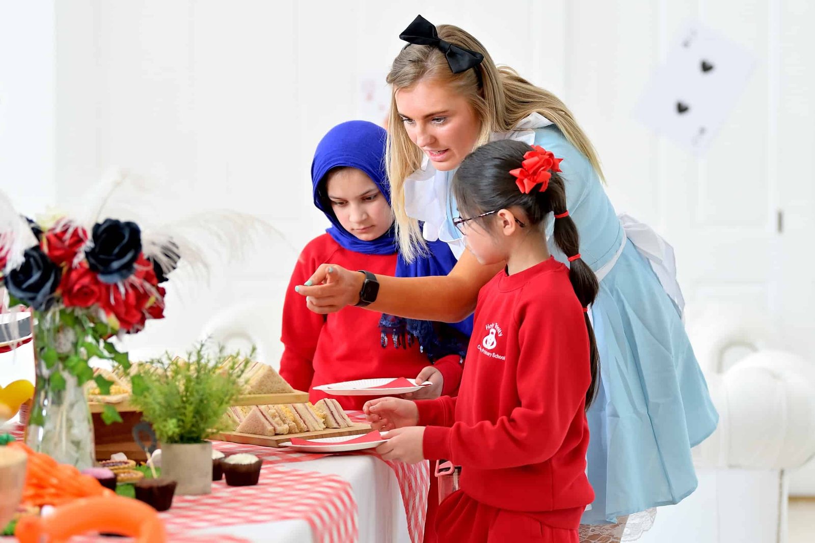 Primary school pupils enjoy 'Mad Hatters Tea Party' courtesy of Everton in the Community and Liverpool Relish