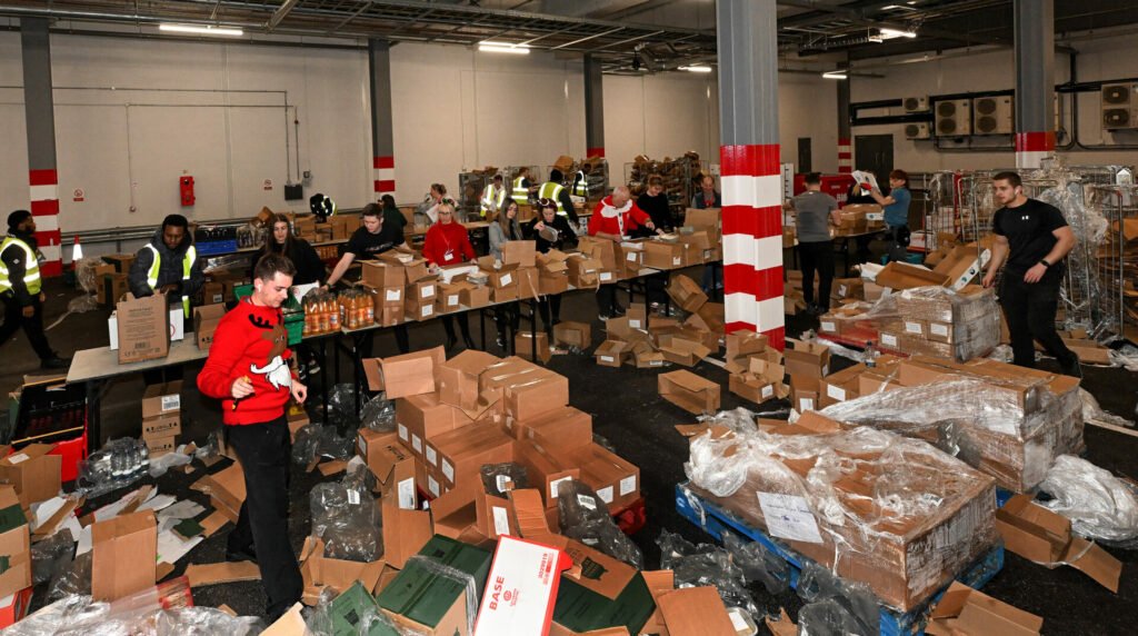 Ian Rush helps deliver 2,000 Christmas dinner hampers to local families